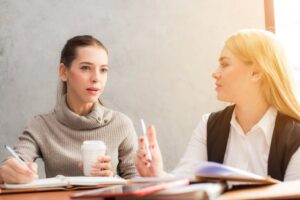 Career women discussing gender pay discrimination