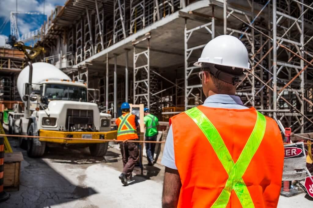 Construction workers observing proper public safety regulations