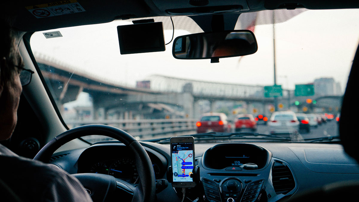 Uber driver using a smartphone while driving