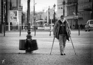old man with crutches can’t find a job due to disability discrimination