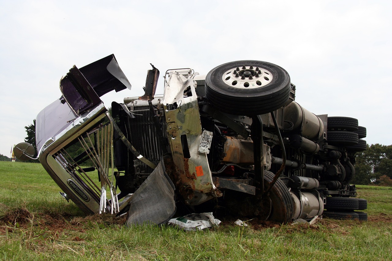 Truck topples down a field after a crash