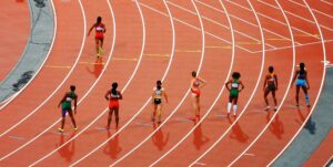 female athletes running on a race track